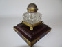 Rare mid 19th century partners inkwell with a double opening brass top and cut crystal on a wooden base with brass mounts.