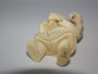 Antique Japanese ivory netsuke detailed in design of a man holding an item dated Meiji period (1868-1912),  signed