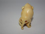 Japanese ivory netsuke of dog with ball, signed.