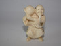 Japanese ivory netsuke man holding and item, signed.