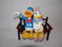 Disney Donald and Daisy Duck in love in love sitting on a bench, made from polyresin material circa 1990s