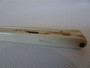 Antique French ivory folding manicure set with concealed nail tools and aged ivory case, measuring approximately 6.5 cm.