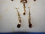Vintage Bess gold-toned necklace and matching earrings with simulated gemstones in original presentation box.