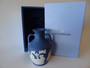 Vintage Wedgwood dark blue jasperware portland vase decorated with classical roman scenes and in original box.