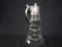 Antique silver plated claret jug with bacchus head spout and etched glass detail.