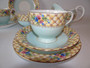 Rare Aynsley tea for two 8 piece tea set decorated with floral design and gold chintz dated 1934-1950.