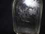 Antique glass liquor bottle/flask deeply engraved with stag and deer in a forest and monogram AH to rear.