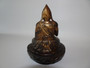 18th/19th century Sino Tibetan bronze Tsongkhapa buddha holding  a tribute  in one hand and in a pose on a lotus base.  Evidence of gilt and lacquer.