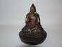 18th/19th century Sino Tibetan bronze Tsongkhapa buddha holding  a tribute  in one hand and in a pose on a lotus base.  Evidence of gilt and lacquer.