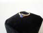 Vintage 10K gold ring with cabochon sapphire on black velvet ring box