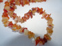 Vintage carnelian chip necklace displaying rich orange and amber gemstone chips.