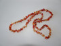 Vintage carnelian chip necklace displaying rich orange and amber gemstone chips.