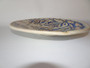 Vintage La Menora Talavera ceramic wall plate showing a hand-painted nobleman figure with floral motifs in blue and golden hues.