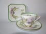 Royal Doulton Glamis Thistle trio signed by P. Curnock with thistle design – teacup, saucer, and square plate