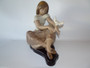 Lladro 3526 Watching the Dove porcelain figurine with wooden base, designed by Juan Huerta, issued 1982, retired 2019, measures 35 cm x 30 cm