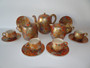 Japanese Meiji Satsuma 15-piece tea set by Hayakawa with millefleur pattern and gilded decoration