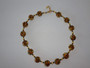 Eleanora – handcrafted necklace, bracelet, and earrings set with golden tones and 24k gold foil accents.