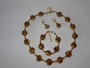 Eleanora – handcrafted necklace, bracelet, and earrings set with golden tones and 24k gold foil accents.