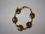 Eleanora – handcrafted necklace, bracelet, and earrings set with golden tones and 24k gold foil accents.