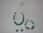 Ava Green – handcrafted necklace, bracelet, and earrings set featuring green and ivory glass beads with copper accents.
