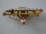 Australian Robert Rollason 9ct gold brooch with red stone, seed pearls, and heart charm circa 1900