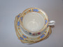 1927–1935 Royal Albert Crown China handpainted floral trio with cup, saucer and plate