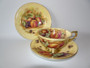 Vintage Aynsley Orchard Gold trio with fruit design and gold trim