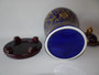 Large blue and gold decorative lidded ceramic jar on wooden stand