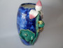 Chinese Shiwan pottery vase with relief bird perched on lotus stem in blue and green glazes