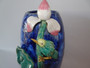 Chinese Shiwan pottery vase with relief bird perched on lotus stem in blue and green glazes