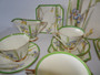 Royal Doulton Art Deco Iris 21-piece tea set with green border and floral design