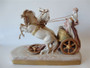 Antique Royal Dux Bohemian porcelain sculpture of a classical charioteer with two rearing horses, circa 1900, approximately 40cm long.