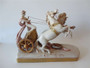 Antique Royal Dux Bohemian porcelain sculpture of a classical charioteer with two rearing horses, circa 1900, approximately 40cm long.