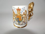 1953 Queen Elizabeth II coronation Staffordshire cup with Royal coat of arms and gilded lion handle