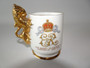 1953 Queen Elizabeth II coronation Staffordshire cup with Royal coat of arms and gilded lion handle