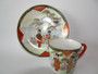 Antique Japanese Meiji Kutani demitasse cup and saucer geisha garden scene