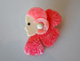 Vintage Lea Stein Paris Corolle girl brooch in pink and fuchsia swirls with cream face and black star eye