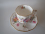 Royal Crown Derby Derby Posies demitasse cup and saucer with floral decoration and gilt trim