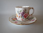 Royal Crown Derby Derby Posies demitasse cup and saucer with floral decoration and gilt trim