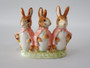 Beswick Beatrix Potter Flopsy, Mopsy and Cottontail figurine with gold oval backstamp.