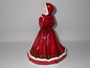 Royal Doulton Pretty Ladies Christmas Wish 2011 HN5429 figurine in red festive gown carrying a festive wreath.