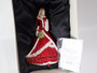 Royal Doulton Pretty Ladies Christmas Wish 2011 HN5429 figurine in red festive gown carrying a festive wreath.