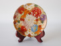 Antique Japanese Satsuma millefiori trinket dish with colourful hand-painted floral decoration and gilt detailing.