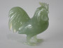Chinese carved green hardstone rooster with finely detailed plumage and softly translucent finish, circa 1950–1970.