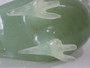 Chinese carved green hardstone rooster with finely detailed plumage and softly translucent finish, circa 1950–1970.