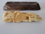 Antique Japanese Meiji period ivory okimono depicting a man and young boy beside a woven basket, signed and displayed on a carved wooden stand.
