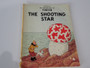 Set of four vintage Tintin Magnet Edition books by Hergé featuring Lake of Sharks, Land of Black Gold, The Castafiore Emerald and The Shooting Star.
