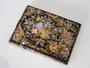 Victorian black lacquered card case decorated with gold gilt scrollwork and iridescent mother-of-pearl and abalone shell floral motifs.