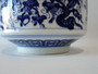 Vintage Chinese blue and white porcelain covered jar decorated with traditional grapevine motifs and matching domed lid.