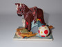 1989 Peter Fagan Rocking Horse HS625 surrounded by colourful childhood toys from the Home Sweet Home Collection.